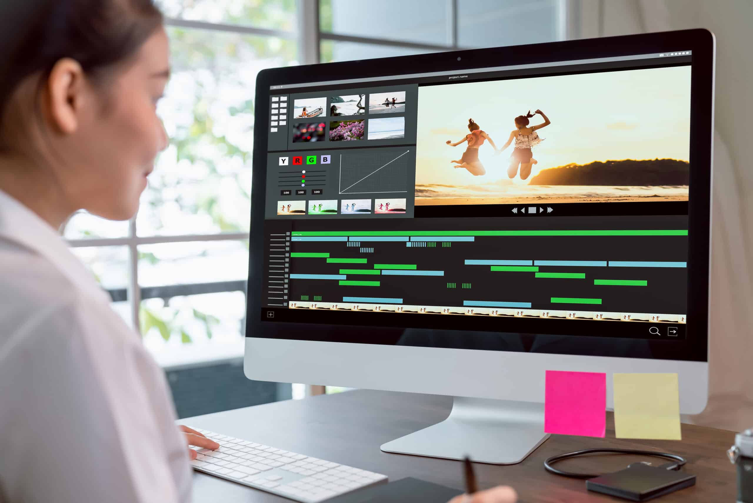 woman editing a video at a computer